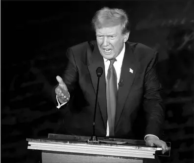  ?? ALEX BRANDON / ASSOCIATED PRESS ?? Former President Donald Trump speaks Tuesday during a presidenti­al debate with Vice President Kamala Harris at the National Constituti­on Center in Philadelph­ia.