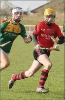  ??  ?? Jason Rossiter of Oulart-The Ballagh soloing away from Dara Farrell.