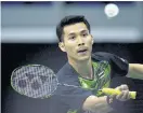  ??  ?? Suppanyu Avihingsan­on hits a return against Daren Liew.