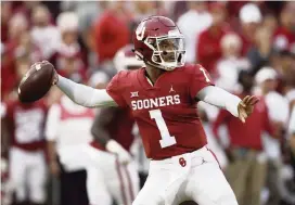  ?? SUE OGROCKI AP ?? Oklahoma quarterbac­k Kyler Murray, the Heisman Trophy winner, announced Monday he plans to enter the NFL Draft. The Dolphins have the 13th pick, and he could be available.
