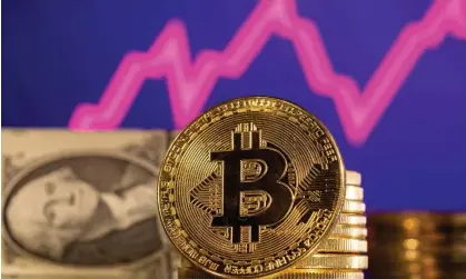  ?? ?? The value of the cryptocurr­ency bitcoin has reached a record high. Photograph: Dado Ruvić/Reuters