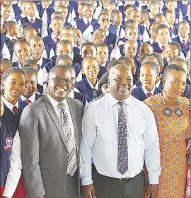  ?? (File pic) ?? Minister of Education and Training Owen Nxumalo (C) and Hhohho Region REO, Dr Nathi Nkambule, Under Secretary Nanikie Mnisi with pupils during one of his school tours. This is not to suggest the other people in the picture are linked to the article.