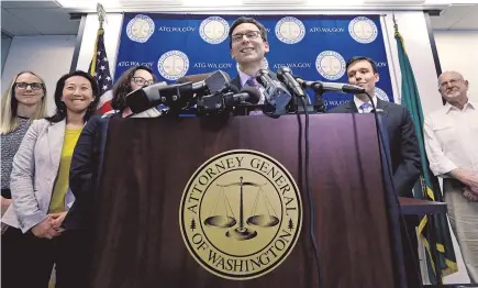  ??  ?? Washington state Attorney- General Bob Ferguson explains a federal appeals court’s refusal to reinstate President Donald Trump’s travel ban. “SEE YOU IN COURT. THE SECURITY OF OUR NATION IS AT STAKE!” — “Well, Mr President, we just saw you in court,...