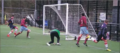  ?? Match report and photos: Derek Black ?? Daniel MacCuish turns in Matthew Kelly’s cutback for Saints second goal.