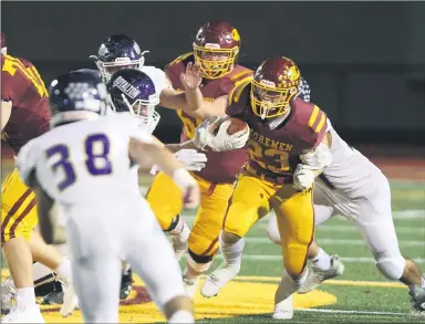  ?? MARK KEMPTON — FOR THE MORNING JOURNAL ?? Avon Lake’s Mason Wheeler carries Oct. 23against North Royalton in the Shoremen’s Division II playoff victory.