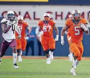  ?? [PHOTO BY SARAH PHIPPS, THE OKLAHOMAN] ?? Oklahoma State’s Justice Hill (5) rushes for 92 yards in front of linemen Shane Richards (67) and Arlington Hambright (51) in OSU’s win over Missouri State on Aug. 30.