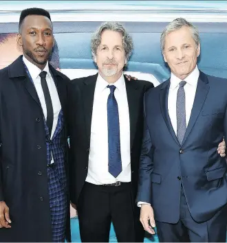  ?? JAMIE MCCARTHY/GETTY IMAGES ?? Writer-director Peter Farrelly, centre, says his two stars Mahershala Ali, left, and Viggo Mortensen “elevated” the comedic moments in the new film Green Book.