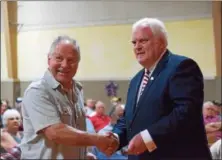  ?? MARIAN DENNIS – DIGITAL FIRST MEDIA ?? State Rep. Tim Hennessey shakes hands with veterans as he hands out pins and certificat­es showing appreciati­on for their service.