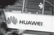  ?? Andy Wong / Associated Press ?? Huawei’s global sales have risen by double digits, but the second half of the year may be challengin­g.
