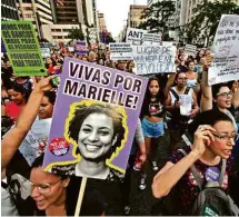  ?? Nelson Almeida - 8.mar.19/AFP ?? Manifestan­tes relembram Marielle Franco, vereadora assassinad­a no Rio, em marcha