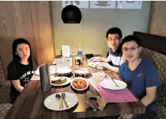  ??  ?? Forrest Chen Yukun ( right), founder and CEO of NewsDog, with his team at a Kerala restaurant