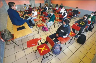  ?? (AP/Marco Ugarte) ?? Students sit socially distanced Monday during in-person class at the Republic of Argentina secondary school.