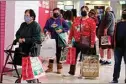  ?? RINGO H.W. CHIU / AP FILE ?? Black Friday shoppers wearing face masks wait in line to enter a store at the Glendale Galleria in Glendale last year.