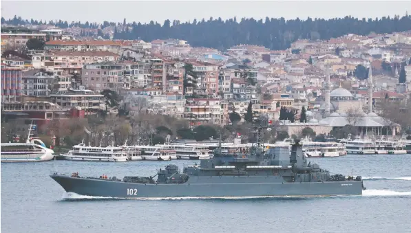  ?? — REUTERS ?? The Russian Navy's Ropucha-class landing ship Kaliningra­d sets sail in the Bosphorus on its way to the Black Sea Saturday.