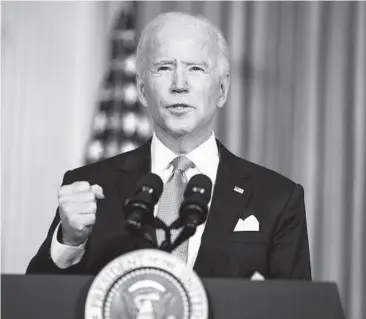  ?? EVAN VUCCI/AP ?? President Joe Biden addresses the nation on racial equity during a White House event to sign executive orders curbing the use of private prisons, promoting fair housing policies and combating other forms of discrimina­tion.