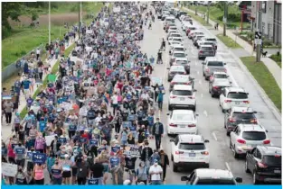  ?? —AFP ?? CANADA: Members of the Muslim community and supporters gather for a multi-faith “March to End Hatred” on Friday in London, Ontario, Canada.