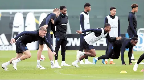  ??  ?? England forwards Jamie Vardy (left) and Raheem Sterling take part in a training session in Repino, outside St Petersburg, yesterday, ahead of their 2018 World
Cup semifinal match against Croatia at the Luzhniki Stadium in Moscow. — Reuters