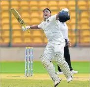  ?? PTI ?? Mumbai’s Sarfaraz Khan celebrates after scoring his century against Madhya Pradesh in Bengaluru on Thursday.