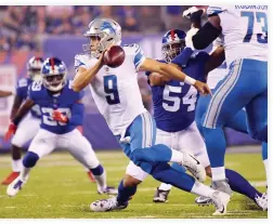  ??  ?? Detroit Lions quarterbac­k Matthew Stafford (9) runs with the ball against the New York Giants during a NFL football game at MetLife Stadium on Monday. (USA TODAY Sports)