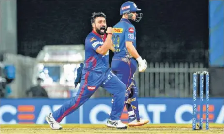  ?? BCCI ?? Amit Mishra of Delhi Capitals celebrates the wicket of Hardik Pandya of Mumbai Indians during their IPL match in Chennai on Tuesday. Mishra also bagged the key wickets of Rohit Sharma, Ishan Kishan and Kieron Pollard to help restrict the defending champions to 137 in 20 overs.