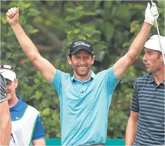  ??  ?? Gregory Bourdy celebrates his hole-in-one at the third.