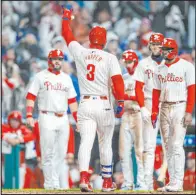  ?? Chris Szagola The Associated Press ?? Phillies first baseman Bryce Harper hit three homers against the Cincinnati Reds on Tuesday. The Phillies won 9-4.