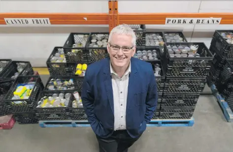  ?? MICHAEL BELL ?? Steve Compton, CEO of Regina Food Bank, says this month’s food drive is the most important food-raising event of the season for the operation. On Oct. 14, residents can leave Food Drive grocery bags on their front door steps between 9 a.m. and 5 p.m....