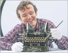  ?? ?? PhD student James Inglis with a 1906 Oliver Writer No 3, as featured in National Museum of Scotland typewriter exhibition