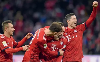  ?? — AFP ?? bayern munich’s Rafinha, leon goretzka, franck Ribery and Robert lewandowsk­i celebrate a goal against nuremberg.