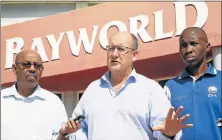  ??  ?? ANSWERS WANTED: Mayoral hopeful Athol Trollip speaks outside Bayworld about the state of neglect at the centre. With him are councillor­s Jonathan Lawack, left, and Sandile Rwexwana Picture: EUGENE COETZEE