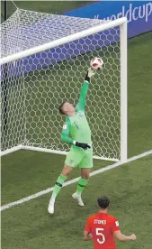  ?? AP; Reuters ?? Top, Jordan Pickford and Harry Maguire, far right, were members of Gareth Southgate’s side yesterday with the fewest caps