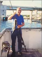  ?? COURTESY OF MARY-LOU BROCKETT DEVINE ?? Paul Brockett Sr., 79, of East Lyme, who ran the fishing charter Mijoy 747 out of Waterford, is seen in this photograph from the late 1990s on the current Mijoy, which he was getting ready to sail this month. Brockett recently died of COVID-19.