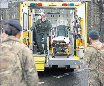  ?? Picture Getty ?? We report on crisis last week
The Army help an ambulance paramedic during the Covid crisis