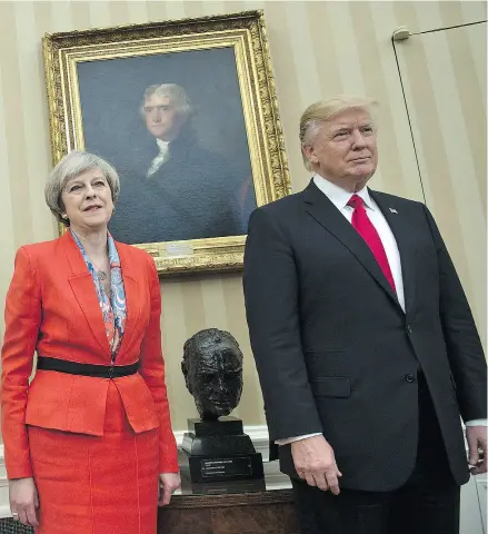  ?? BRENDAN SMIALOWSKI /AFP / GETTY IMAGES ?? British Prime Minister Theresa May and U. S. President Donald Trump meet beside a bust of former British Prime Minister Winston Churchill in the Oval Office of the White House on Friday.