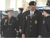  ??  ?? Legion president Roy Labuick jokes with a cadet during his inspection of the Assiniboin­e sea cadets.