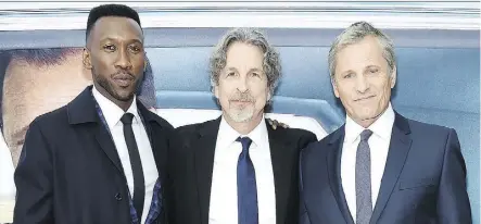  ?? JAMIE MCCARTHY/GETTY IMAGES ?? Writer-director Peter Farrelly, centre, says his two stars Mahershala Ali, left, and Viggo Mortensen “elevated” the comedic moments in the new film Green Book.