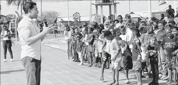  ?? ?? Minister of Culture, Youth, and Sport Charles Ramson Jr. addresses the participan­ts at the National Aquatic Centre.