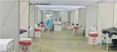  ?? Picture: Neil McCartney ?? HARD TIMES. Healthcare workers inside the quarantine site at Nasrec field hospital in July.