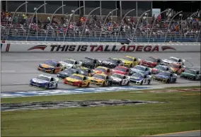  ?? BUTCH DILL - THE ASSOCIATED PRESS ?? FILE - In this Oct 14, 2019, file photo, Ryan Blaney (12) leads a pack of cars through the trioval during a NASCAR Cup series auto race at Talladega Superspeed­way in Talladega, Ala.