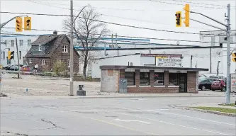  ?? MATHEW MCCARTHY WATERLOO REGION RECORD ?? The Exotic Skin Tattoo Shop sits alone in front of an empty lot on King Street at Ottawa Street in east Kitchener, where more developmen­t projects are fast approachin­g, as land elsewhere in the city and Waterloo dwindles.