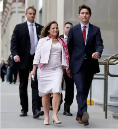  ??  ?? Canada’s Prime Minister Trudeau (right) walks to a news conference with Foreign Minister Chrystia Freeland in Ottawa, Ontario, Canada. — Reuters photo
