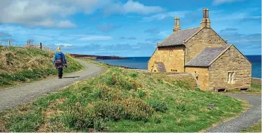  ??  ?? Ramble on: A walker on the coast path in Northumber­land, home to Hadrian’s Wall