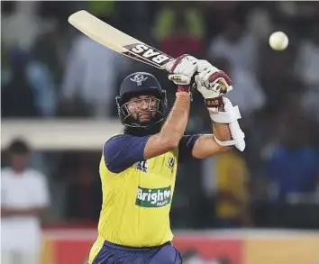  ?? AFP ?? World XI batsman Hashim Amla goes over the top during the second Twenty20 internatio­nal against Pakistan at the Gaddafi Stadium in Lahore on Wednesday.