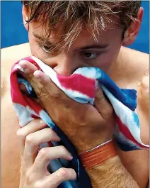  ??  ?? SUNK: Tom Daley realises he’s out of the Olympics after failing to make the 10m platform final