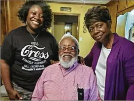  ?? COURTESY ?? Shonda Bell poses with her parents, Walter and Charlie Mae Cross of Albany, who were both diagnosed with Alzheimer’s disease several years ago. She is the main caregiver for both. She has joined a support group for caregivers and relies on her faith.