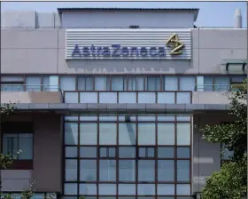  ?? (AP) ?? The AstraZenec­a building in Shanghai, China, is shown in this file photo. Drugmakers including AstraZenec­a Plc have agreed to cut prices on some of their newest drugs in China by an average of 51% to be covered by the country’s national insurance fund.