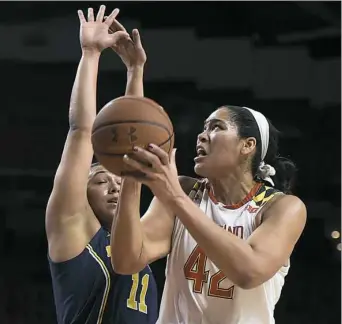  ?? Gail Burton/Associated Press ?? Maryland’s Brionna Jones, right, had 25 points and 10 rebounds Thursday against Michigan in College Park, Md.