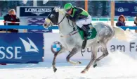  ??  ?? Jockey Janacek rides Nil Aziz to victory on the snow laden track