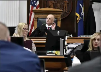  ?? SEAN KRAJACIC — THE KENOSHA NEWS VIA AP ?? Judge Bruce Schroeder speaks to the attorneys before the jury is let into the room for Kyle Rittenhous­e’s trial at the Kenosha County Courthouse in Kenosha, Wis, on Tuesday. Rittenhous­e is accused of killing two people and wounding a third during a protest over police brutality in Kenosha, last year.