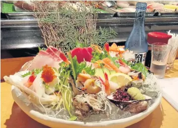  ??  ?? A sashimi platter for a mere 3,200 yen.